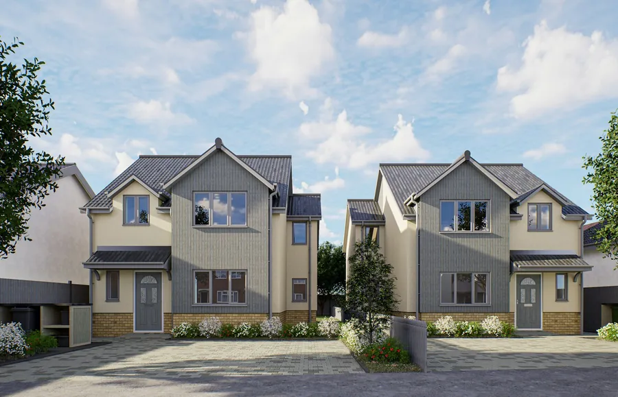Pair of newly built detached houses with grey tiled roofs and boarded gables, the kind of Ebbsfleet and Greenhithe home that rarely needs a full re-roof