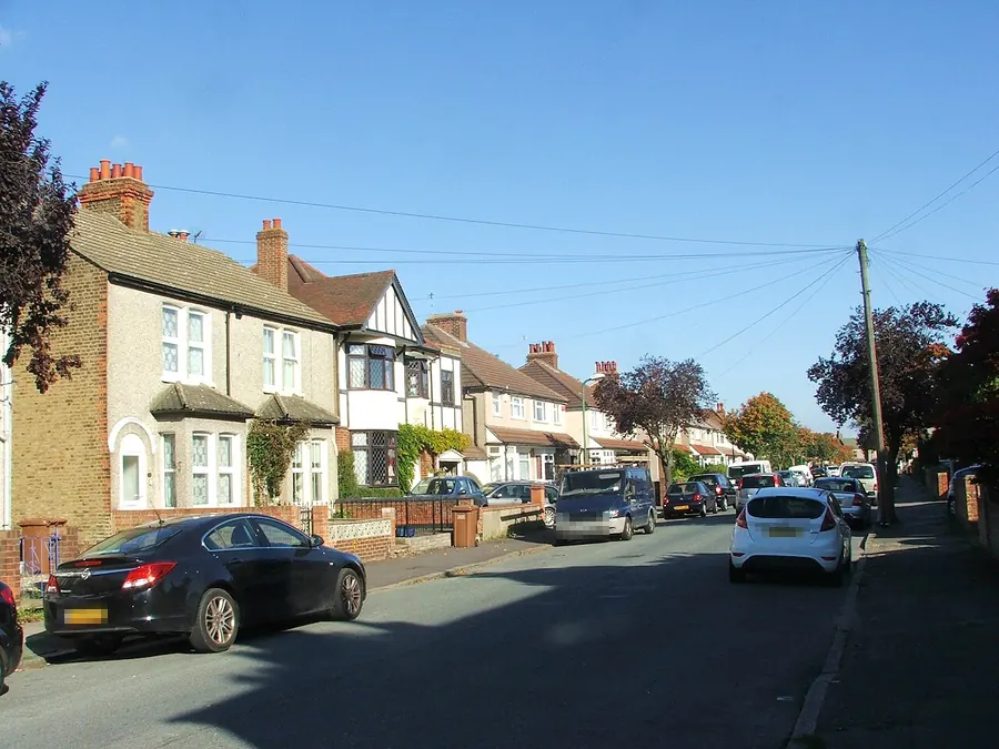 Bay-fronted Edwardian houses with tiled roofs and chimneys along Carrington Road, Dartford