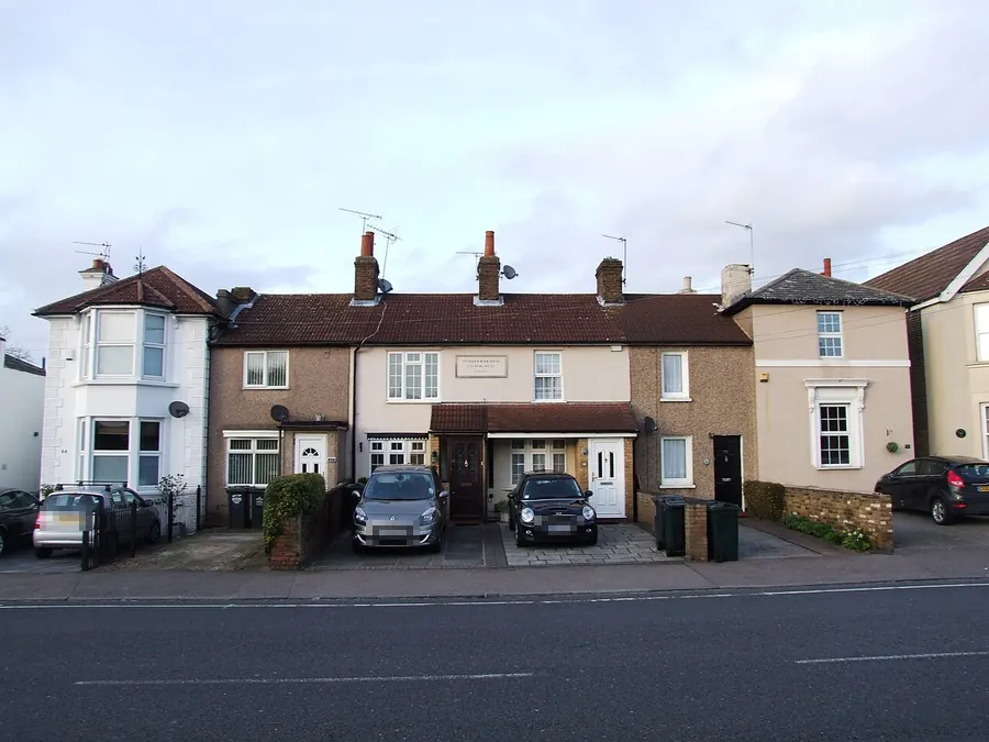 Mixed row of older terraced cottages with chimneys and tiled roofs on Whitehall Terrace, Dartford