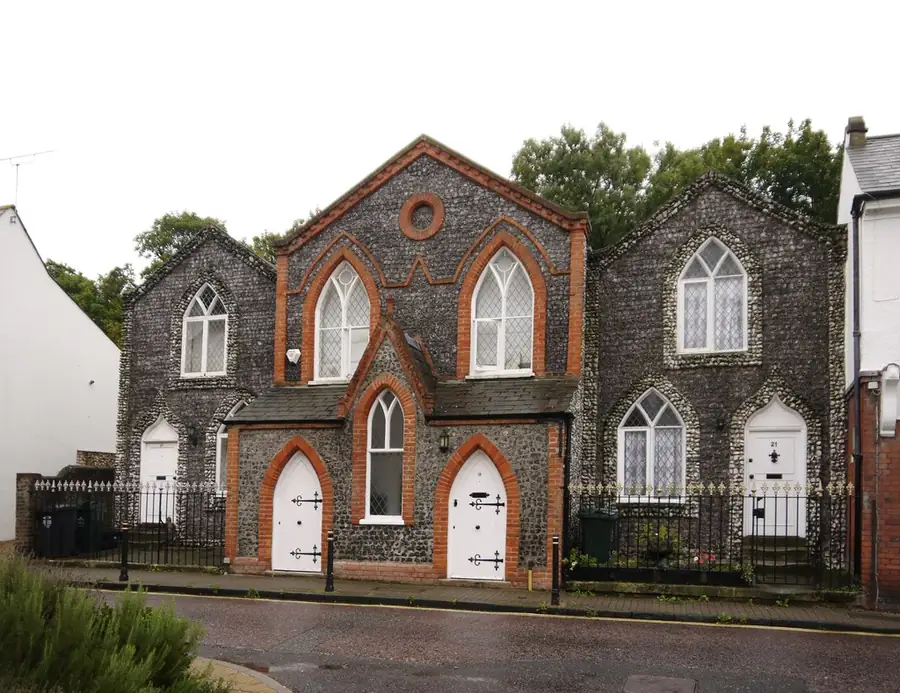 Gothick-style flint cottages with brick dressings and slate roofs on Greenhithe High Street