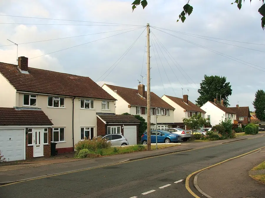 Semi-detached houses with tiled roofs and garages on Oakwood Rise, Longfield