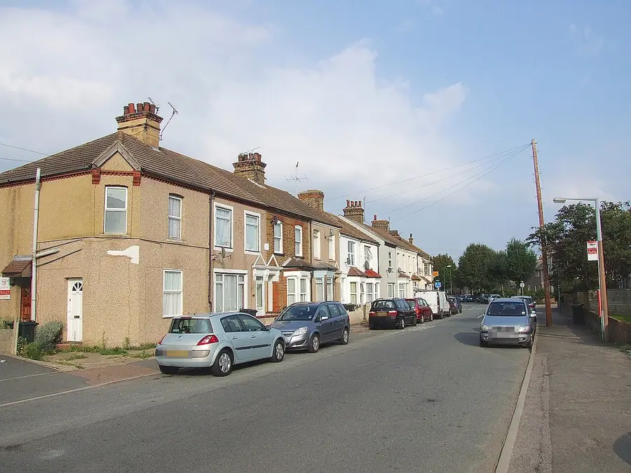Rendered Victorian terrace with chimney stacks on Milton Road, Swanscombe